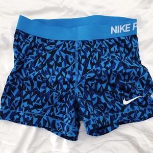 Blue patterned Nike PRO 3” inseam shorts